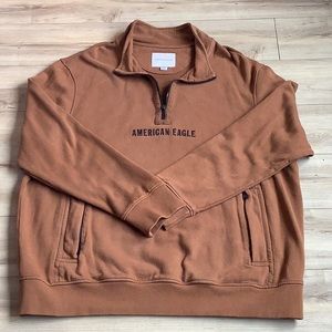 Men’s pullover long sleeve jersey with zippered v-neck. Has 2 zippered pockets